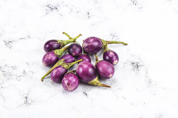 Small organic young purple round eggplant