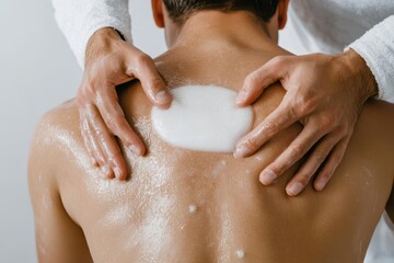 Wall Mural - Hands applying pain-relieving gel to a patient's back during therapy, pain relief gel therapy, topical treatment for back pain