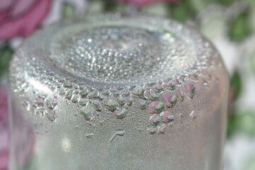 Sticker - A close-up shot of a glass bottle filled with water, often used in product photography or as a prop in still life compositions.