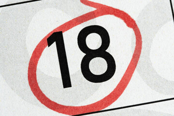 Eighteen number in calendar is circled with red marker.