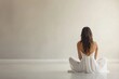 © mohdfaizal - Woman in White Dress Sitting on Floor with Back to Camera