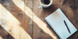 © alenagurenchuk - Blank notebook is lying on a wooden table with a cup of coffee and sunbeams