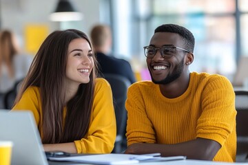 Wall Mural - Sharing fresh ideas. Two young happy multiracial business people sitting at desk and communicating while working together in coworking space, Generative AI