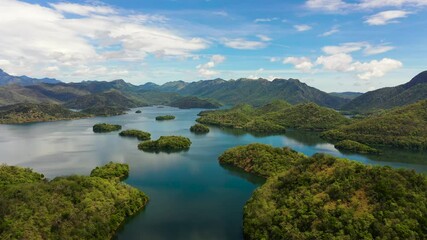 Poster - Mountain lake among hills with tropical vegetation and blue sky with clouds. Randenigala reservoir, Sri Lanka.