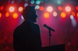 © Phoenix AI Photo - Silhouette of a speaker at a vibrant event, highlighted by colorful stage lights, capturing the essence of public speaking.
