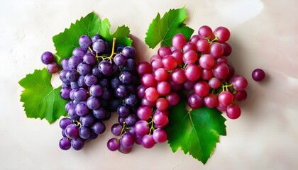 Vibrant red and purple grapes with lush green leaves on a textured background, embodying freshness and health in a delightful food presentation