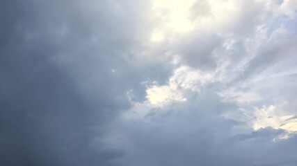 Wall Mural - White changing beautiful clouds time lapse with blue sky background. Timelapse of fluffy cumulative storm clouds in the village. copy space. 4K.