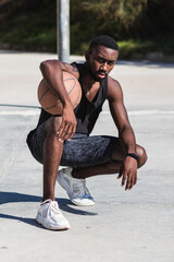 Wall Mural - Portrait of basket player posing outdoors