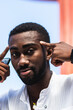 © BUDDHA - Young black man doing a concentration gesture