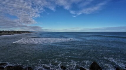 Wall Mural - Beautiful view of the ocean with blue sky at New Zealand West Coast.