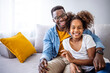 © Dragana Gordic - Happy Father and Daughter Smiling Together on Couch