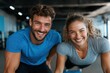 © Milos - A health-conscious couple, smiling and enjoying their workout at a modern gym, highlights their shared journey towards fitness, health, and the joy of being together.