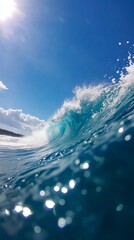 Wall Mural - a large wave breaking in the ocean with a blue sky in the background