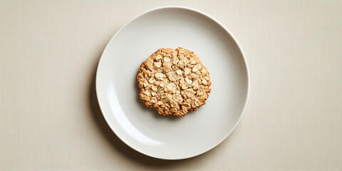 Canvas Print - Single oatmeal cookie placed on a flat dessert plate