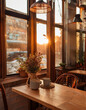 © Pixel Pioneer - Golden Hour Cafe: Empty tables bathed in the warm glow of sunset through panoramic windows, capturing the tranquil ambiance of a cozy cafe.