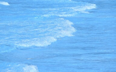 wave on blue water surface on sea in sunny day background and texture  