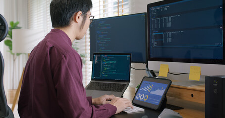 Digital transformation future workforce web DEV career development. Asia people young talent man busy work at home office reskill upskill martech job remote test on AI cloud computing cyber security.