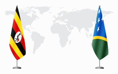 Uganda and Solomon Islands flags for official meeting against background of world map.