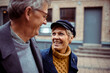 © Davor - Elderly couple sharing a joyful moment on a city walk