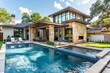 © CojanAI - Small modern home exterior with backyard pool