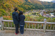 © Noppasinw - Shirakawago village Gifu Japan love couple tourists looking at Gassho house in autumn season