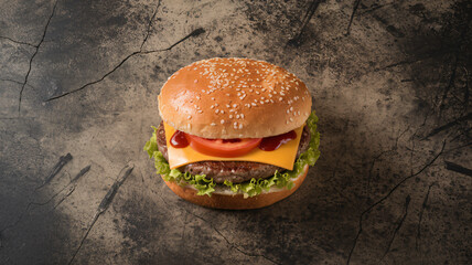 Juicy cheeseburger with sesame seed bun, lettuce, tomato, cheese, and a hint of ketchup, set on a cracked, textured surface, offering a bold contrast between rustic background and gourmet fast food.

