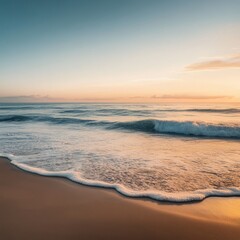 Wall Mural - Peaceful ocean waves breaking on a sandy beach at sunset.