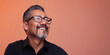 © Elena - Studio headshot portrait of smiling professional Hispanic man with facial hair, glasses, and black button up shirt