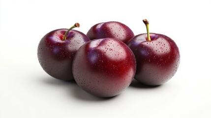 Plums in focus on white background, highlighting natural colors and textures.