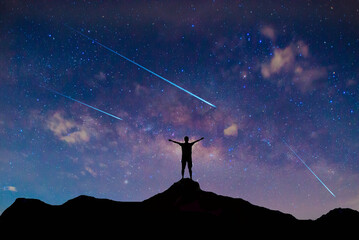 Wall Mural - meteorites fly in the night sky. bright meteors glow in the atmosphere. beautiful shooting stars.