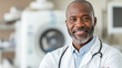© Nataliya - A 58-year-old African American internist with a slightly plump build, standing with crossed arms in a bright and modern ultrasound lab, the well-lit setting showcasing his experien