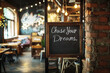 © Photocreo Bednarek - Chalkboard in cozy cafe displaying chase your dreams message