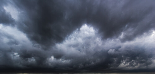 Aufkleber - The dark sky with heavy clouds converging and a violent storm before the rain.Bad or moody weather sky and environment. carbon dioxide emissions, greenhouse effect, global warming, climate change.