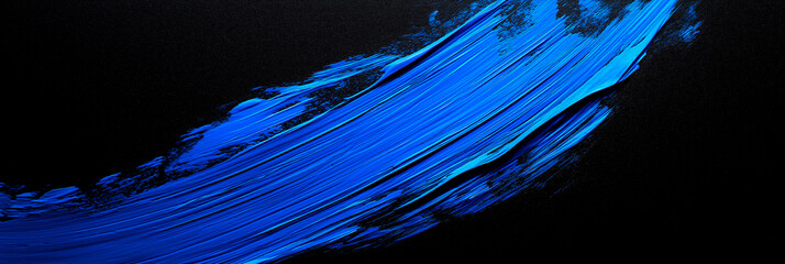 Wall Mural - bright blue brush stroke of paint on black background