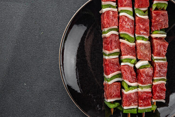 raw kebab meat and vegetables pork, lard, pepper, vegetable dish fresh delicious gourmet food background on the table rustic food top view copy space