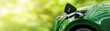 © Natalia - Close-up of a car charging at an electric vehicle charging station, with real-time battery data on a connected app, EV charging station connection, green tech
