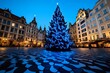 © Sanchai - A holiday postcard from a European city square, with a beautifully lit Christmas tree, historic architecture, and holiday markets