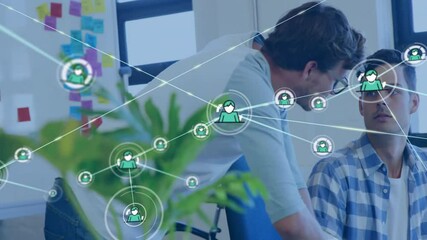 Wall Mural - Animation of network of connections with icons over diverse colleagues discussing work in office