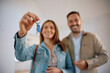© Drazen - Close up of couple with keys of their new home.