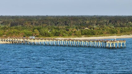 Canvas Print - Aerial view of many tourists enjoying vacation time on Venice fishing pier. Seaside summer activities