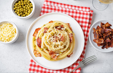 Fried bacon green peas pasta in a plate