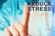 © RafMaster - Close up of a doctor pointing finger up with reduce stress sign on medical background.