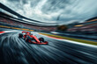 © blinkstud.io - Wide shot dynamic shot of driver racing red formula one car on winding racetrack. Grandstands in background blur of motion.