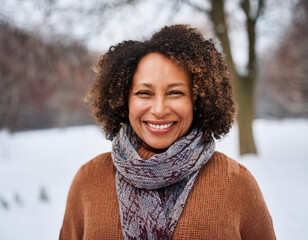 Wall Mural - Portrait of Beautiful Happy Black Woman Outdoors in Park During Winter