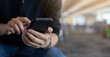© chinnarach - close up man hand hold smartphone to surfing the internet and check news feed on social media or email for technology and lifestyle concept