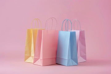 Wall Mural - Cardboard shopping bags of different colors on a light pink background.