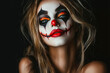 © Hunman - Sexy woman in a Halloween makeup and costume on black background. Halloween makeup and costume concept.