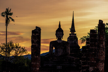 Wall Mural - Background atmosphere inside the important historical tourist attraction Sukhothai Historical Park,foreign tourists from all over the world like to bring their children study history during holiday.