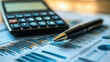 © xinxia - A pen on stock market charts and graphs