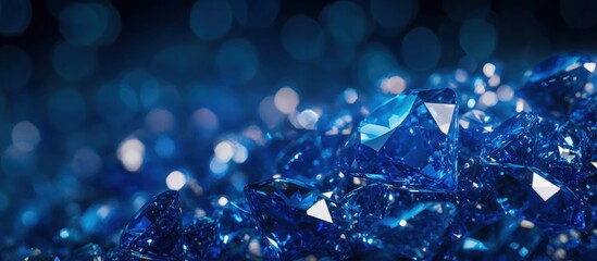 Wall Mural - A shimmering collection of blue gemstones on a blurred background.